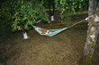 © Jørgen Krielen/Stocksy - Reading in hammock