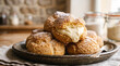 © hardvicore - Freshly baked vanilla cream puffs, crisp golden pastry shells with luscious vanilla cream filling, sugar dusting, appetizing patisserie. Tasty dessert. Close-up.