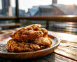 © Aimagin - Crispy Southern fried chicken plate with soft blurred stadium background
