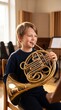 © cloud7days - Young Scandinavian Boy Playing French Horn in Dramatic Light