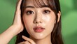 © pumpupin - 日本人若い女性・透明感美肌・半横顔・緑背景固定・美容広告 / Japanese Young Woman Beauty Portrait — Youthful Fresh Face, Half-Side Angle, Seamless Green Backdrop, Beauty Commercial