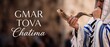 © Dinali - Jewish man blowing shofar horn wearing tallit prayer shawl for Yom Kippur holiday greeting banner with Gmar Chatima Tova text, traditional Rosh Hashanah Jewish high holy days religious celebration.