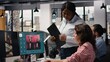 © DC Studio - Diverse team uses generative models for text to image editorial content while an AI virtual assistant creates a photography prompt beside a video streaming platform on a computer monitor in an office.