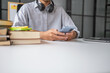 © Charlie's - Student Using Smartphone for Online Education and Internet Research with Artificial Intelligence AI Tools for Learning Research Technology for Everyday Learning.
