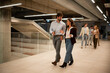 © Zoran Jesic - Business colleagues walking and discussing in modern office building