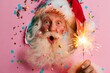 © Gulnaz - Santa Claus beams with delight, holding a sparkler