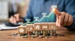 © Panuwat - Wooden blocks with finance icons atop stacked coins illustrating investment growth from 2022 to Financial strategy and wealth planning concept shown through wooden icons and a rising economic graph.