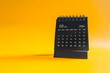 © Steppe-Walker - Desktop calendar showing October 2026 on yellow background, time management and planning concept