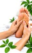 © ARASAN GRAPHICS - Relaxing Foot Massage and Foot Reflexology Treatment at a Wellness Spa