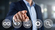 © Its_Pictography - Selecting the Right Path: A businessman in a suit points forward, highlighting digital icons representing the stages of software development and automation.
