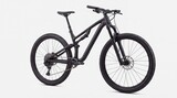 Black mountain bicycle studio shot with suspension and chunky tires on white background