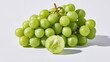 © Image4u - Fresh green grape cluster with plump fruit and sliced grape on pale surface, creating crisp natural food still life with soft shadow
