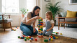 © Muhammad - Mother and daughter stacking wooden block tower on living room floor for construction play fine motor development and creative parenting concept