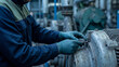 © NK - Vibration sensor installation and predictive maintenance concept, worker in gloves mounting iot sensor on electric motor in factory pump room for condition monitoring and equipment inspection