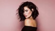 © Fun Factory - Beautiful face brunette woman, wavy dark hair, lipstick lips, bare shoulders top posing gracefully against soft neutral pink studio background showing glowing flawless skin and makeup, side profile