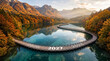 © Nazma_ma - Wooden walkway over a calm blue lake in a beautiful autumn forest with the year 2027 displayed on the path representing a journey into the future