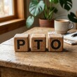 © Janna - PTO Wooden Blocks on Rustic Table with Coffee and Plant Work Life Balance Concept