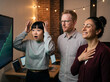 © Lorian - Three startup colleagues reacting to growth metrics on a screen