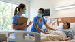© Rohan Katwe - Two hospital nurses conduct bedside shift handover beside adult patient, supporting care coordination, nursing teamwork, clinical communication, continuity of care and patient safety.