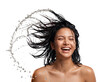 © Napapon - Joyful southeast asian woman displays wet hair with water splash