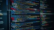 © Bakar Gallery - Computer screen displaying colorful code lines in a dark room. Technology concept for software development.