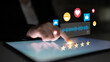 © InfiniteFlow - A person interacts with a digital screen showcasing reviews and reactions, highlighting user engagement in online experiences using technology and communication tools. Ledger