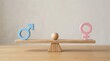 © Mostafizur - Gender equality concept with blue male and pink female symbols balanced on a wooden seesaw scale