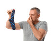 © Pixel-Shot - Bad odor and hygiene, man holding a smelly dirty sock and pinching his nose in disgust, personal freshness and laundry problems on white background