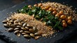 © MstAyesha - A selection of mineral content food items featuring chickpeas kale seeds and quinoa on a rustic black stone surface