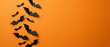 © DYTA - Halloween background with black bats flying on orange background, copy space