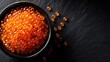 © Thinnawat - Fresh Salmon Caviar in a Bowl on Dark Slate Background