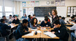 © Jana - A lively secondary school classroom showing multiethnic teenage students sitting at desks engaged in group study and conversation while the female teacher observes in background