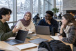 © Rufino - Diverse university students collaborating around a table in a modern