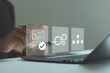 © MUNTHITA - Standard operating procedure (SOP) concept. Businessman use laptop and smartphone with virtual SOP icons that include instructions, quality, process, operation, sequence and workflow.