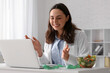 © Pixel-Shot - Telemedicine nutrition consultation, nutritionist providing online diet advice to patient via laptop in clinic office