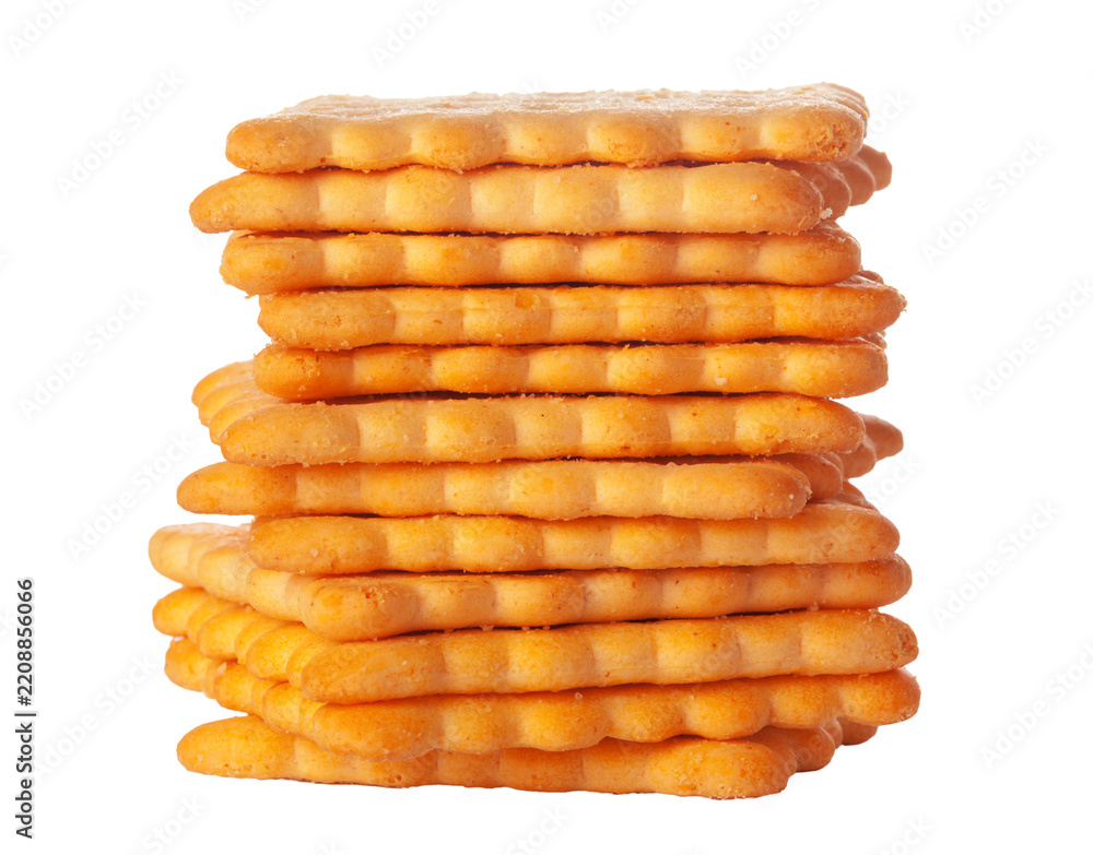 Stack of golden colored crackers placed on a white background Stock ...