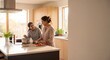 © Hafiz - Happy Mother and Teenage Daughter Cooking Together in a Bright Modern Kitchen, Preparing Healthy Meal with Fresh Vegetables on a White Island