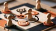 © Shah Zain - Wooden pawn figures on strategic board game with arrows and target symbols for business planning