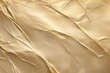 © MOHAMMED - A high resolution full frame macro closeup view of a crumpled and folded metallic gold foil sheet creating abstract geometric shadows
