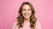 © Fine Craft - Joyful young woman with curly hair beautifully celebrating under bright falling confetti perfect for vivid positive party energy concepts