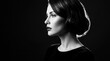 © Svitlana - Elegant woman shown in sharp black-and-white side profile against a deep black background, fine-art beauty photography, sculpted cheekbone and glossy lips, dramatic rim lighting, high contrast,