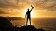 © habib - Silhouette of a man holding a trophy on a cliff at sunset with copy space
