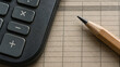© AiHRG Design - A black calculator and sharpened wooden pencil rest on beige grid paper in a detailed close-up, illustrating arithmetic, accounting, budgeting, and financial planning.