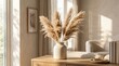 © rezaul4022 - Dried pampas grass in a ceramic vase on a wooden table with copy space