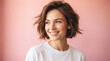 © Im Four - Portrait of a gorgeous smiling young woman against a simple pink background perfect for natural beauty cosmetics and joyful feminine lifestyle campaigns