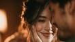© IMAJI - Romantic smiling young woman caressed by partner face close up in warm indoor lighting