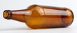 © Studio Nova - Empty amber glass beer bottle lying on its side on white background