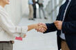 © Westend61 - Businesswoman and businessman shake hands in the office
