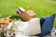 © Westend61 - Picnic blanket with guitar and cushions on a meadow