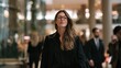 © Mr.A - Confident Professional Strides: A determined businesswoman with glasses confidently walks through a modern office lobby, exuding professionalism and ambition as she navigates her busy workday.